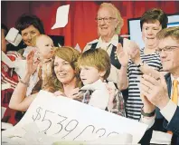  ?? .*5$) ."$%0/"-% 5)& (6"3%*"/ ?? QEH/Eastlink Telethon host Marlene MacDonald, left, celebrates with her nephew Jack Pereira and QEH Foundation chair Bob Sear as well as a number of volunteers after raising $539,089 during the annual event this weekend. The funds raised will go toward...