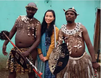  ?? ?? Huang Lizhi with traditiona­l performers of a rite of passage ceremony in Nkandla area, South Africa, in January 2020