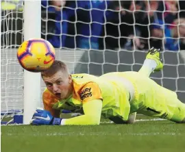  ??  ?? Jordan Pickford keeps the game goalless with his crucial save from Alvaro Morata