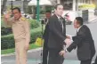  ??  ?? Prayuth Chan-ocha (left) walks off and is replaced by a cutout at a press conference.