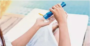  ?? Getty Images / EyeEm ?? Long sleeves, SPF and an umbrella help Yvette Ellerbe protect her skin from sun damage, after being diagnosed with skin cancer several times.