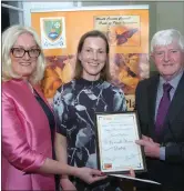  ??  ?? Carla Piner accepts an award for O’Connells Barn from Cllrs Keogan and Kelly.