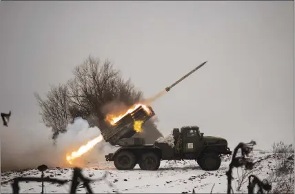  ?? VADIM GHIRDA — THE ASSOCIATED PRESS ?? Ukrainian soldiers fire a multiple rocket launcher at Russian positions Saturday in the Kharkiv area of Ukraine. Russia conducted more strikes.