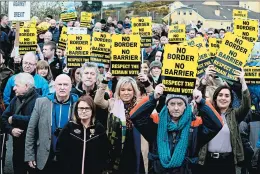  ?? PAUL FAITH/GETTY-AFP ?? Sinn Fein Northern Leader Michelle O’Neill, center, joins protesters Saturday against any barrier between Ireland and Northern Ireland. Barrier fears are rising over a no-deal Brexit.