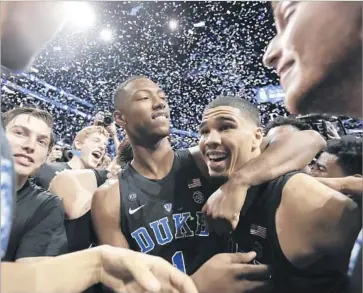  ?? Julie Jacobson Associated Press ?? DUKE PLAYERS are in a festive mood after winning the Atlantic Coast Conference tournament. The Blue Devils are seeded second in the East Regional, but some foresee them as national champions.