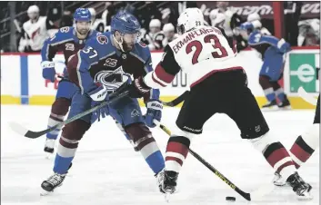  ?? DAVID ZALUBOWSKI/AP ?? COLORADO AVALANCHE LEFT WING J.T. COMPHER (left) loses control of the puck as Arizona Coyotes defenseman Oliver Ekman-Larsson covers in the second period of a game Monday in Denver.