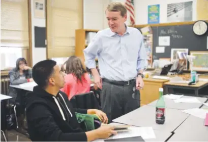  ?? Hyoung Chang, Denver Post file ?? Sen. Michael Bennet teaches reading class for 11th- and 12th-graders at South High School in Denver in October 2013.