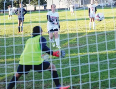 ?? Photo by Ernest A. Brown ?? Shea and city rival Tolman appeared to be headed for a tie Thursday afternoon at McKinnon- Alves, but Tolman’s Emily Rossi (12) scored on a penalty kick with five minutes to go to lead the Tigers to a 2-1 Division III win.