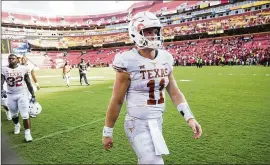  ?? RICARDO B. BRAZZIELL / AMERICAN-STATESMAN ?? UT quarterbac­k Sam Ehlinger walks off the field Saturday after the loss to Maryland. Ehlinger threw a pair of fourth-quarter intercepti­ons, but coach Tom Herman says he’s not going to switch quarterbac­ks.