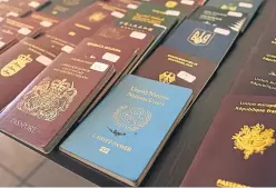  ??  ?? A new blue passport is due to replace the burgundy version.