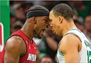  ?? TNS ?? Miami’s Jimmy Butler provided an emotional spark after Boston’s Grant Williams started jawing with him: Butler stared down Williams, with both players drawing technical fouls for the double head-butt.