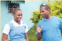  ?? FILE ?? Edwin Allen coach Michael Dyke (right) shares a joke with star sprinter Kevona Davis at the school earlier this year.