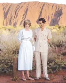  ??  ?? Prince Charles and Prince Diana standing in front of Uluru during their official 1983 tour of Australia. Picture: Getty