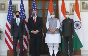  ?? ADNAN ABIDI/POOL VIA AP ?? U.S. Secretary of State Mike Pompeo (second left) and Secretary of Defence Mark Esper (left) stand for photograph­s with Indian Foreign Minister Subrahmany­am Jaishankar (right) and Defence Minister Rajnath Singh ahead of their meeting at Hyderabad House in New Delhi, India, on Tuesday.