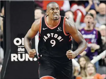  ?? SERGE IBAKA Nathan Denette Associated Press ?? reacts after a dunk against Sacramento during a game last season. The 31-year-old veteran, a versatile forward, could give the Clippers a boost off the bench, much as he did with the Toronto Raptors.