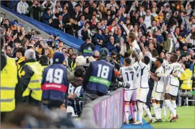  ?? (ZUMA Press Wire/DPA) ?? Real Madrid’s Luka Modric celebrates scoring his side’s first goal with teammates during the Spanish LaLiga match between against Sevilla at Santiago Bernabeu Stadium.