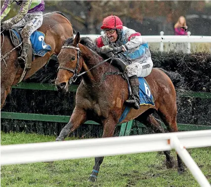  ?? JOSEPH JOHNSON/FAIRFAX NZ ?? Upper Cut clears the last fence on his way to winning the Grand National Steeplecha­se.