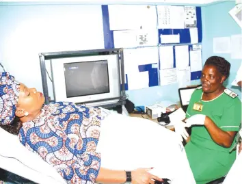  ??  ?? First Lady Auxillia Mnangagwa undergoes screening for cervical cancer at United Bulawayo Hospitals (left) and familiaris­es herself with the food prepared for patients at Mpilo Central Hospital during her national cervical cancer awareness campaign. —...