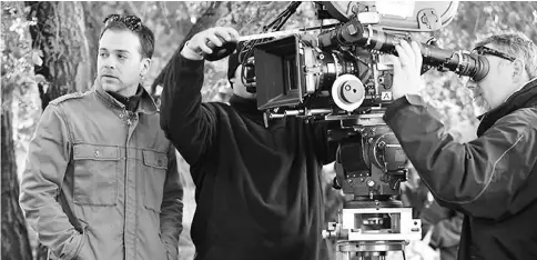  ??  ?? ‘Wonder Woman’ cinematogr­apher Jensen (left) working on set. His passion for filmmaking has roots in Washington. — Courtesy of Matt Jenkins