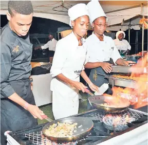  ?? PHOTOS BY IAN ALLEN/PHOTOGRAPH­ER ?? From left: Chefs Stephen Grant, Jamique Mair and Shanice Blackwood in action, preparing tasty pasta dishes.