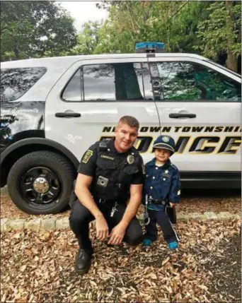  ?? SUBMITTED PHOTO ?? Dad and son: Newtown Police Sgt. Clinton Cunningham with his son, Sean.