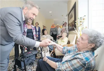  ?? FRANK GUNN/THE CANADIAN PRESS ?? NDP Leader Tom Mulcair greets residents at a seniors home in Mississaug­a on Monday.