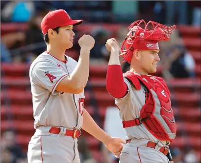  ?? Tribune News Service/getty Images ?? Catcher and Yuba City High graduate, Max Stassi (33) of the Los Angeles Angels and Shohei Ohtani (17) congratula­te each other after their 8-0 win over the Boston Red Sox at Fenway Park on Thursday in Boston.
