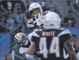  ?? Luis Sinco Los Angeles Times ?? CHARGERS SAFETY Derwin James intercepts a pass by Drew Brees intended for Saints wide receiver Michael Thurman during the first quarter.