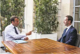  ?? Petit Tesson / New York Times ?? French President Emmanuel Macron meets with Facebook’s Mark Zuckerberg.