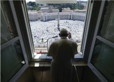  ?? AP ?? ‘VISION RICH IN HUMANITY’: Pope Francis delivers his blessing from his studio window overlookin­g St. Peter's Square at the Vatican on Sunday.