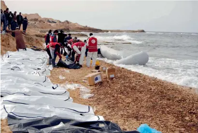  ?? AP ?? The bodies of people that washed ashore and were recovered by the Libyan Red Crescent, near Zawiya, Libya. The Libyan Red Crescent says at least 74 bodies were found on Monday, and that more may yet surface. —