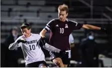  ?? MEDIANEWS GROUP PHOTO ?? Matching 10’s battle for the ball as Abington’s Gavin O’Neill and Pennridge’s Kevin Link meet at midfield during the opening-round playoff game last season. O’Neill has just recently committed to continue his soccer career at Rowan in the fall.