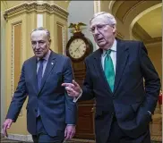  ?? AL DRAGO / NEW YORK TIMES ?? Senate Majority Leader Mitch McConnell, R-Ky., (right) may cancel the August recess to fight Democratic opposition, led by Senate Minority Leader Chuck Schumer (D-N.Y.), to GOP priorities.