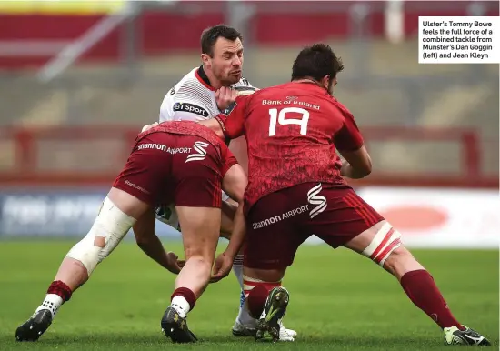  ??  ?? Ulster’s Tommy Bowe feels the full force of a combined tackle from Munster’s Dan Goggin (left) and Jean Kleyn