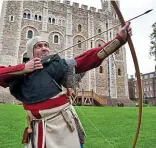  ??  ?? Take a bow: Modern archer Andy Deane commemorat­ing Agincourt