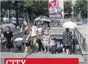  ??  ?? Commuters emerge from Pyongyang Metro