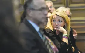  ?? Cloe Poisson / Hartford (Conn.) Courant ?? Nicole Hockley, who lost her son Dylan in the Sandy Hook School shooting, waits to hear arguments in a lawsuit filed against Remington Arms.