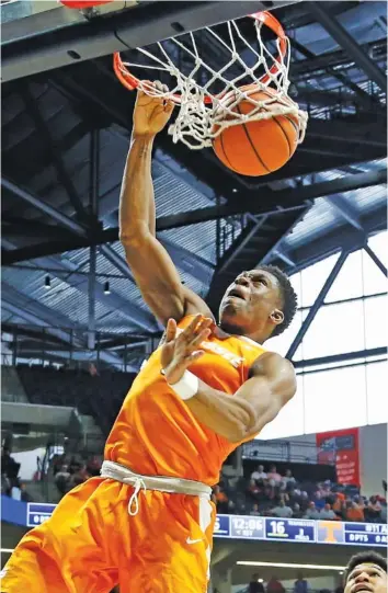  ?? THE ASSOCIATED PRESS ?? Tennessee forward Admiral Schofield dunks against Mississipp­i during the first half of their SEC game Saturday in Oxford, Miss. Schofield led the Vols’ 73-65 victory with a career-high 25 points.