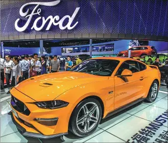  ?? LIU JIAHAO / FOR CHINA DAILY ?? A Ford Mustang attracts visitors at this year’s Shanghai auto show.