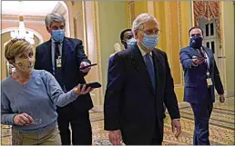  ?? SUSAN WALSH / AP ?? Senate Majority Leader Mitch McConnell of Ky., walks past reporters on Capitol Hill in Washington Tuesday.