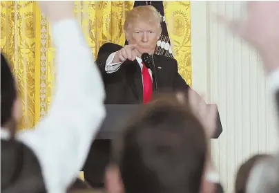  ?? AP PHOTO ?? ‘VERY FAKE NEWS’: President Trump calls on a reporter during yesterday’s news conference at the White House, during which he lambasted The New York Times, CNN and other news media.