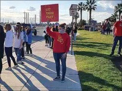  ?? CLAY CUNNINGHAM / THE CALIFORNIA­N ?? Parent Heather Manning takes part in a Let Them Play rally in Bakersfiel­d on Friday.