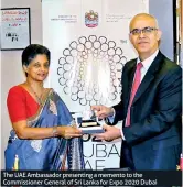  ??  ?? The UAE Ambassador presenting a memento to the Commission­er General of Sri Lanka for Expo 2020 Dubai