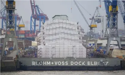  ?? ?? The the world’s largest superyacht, Dilbar, is undergoing extensive repairs in Hamburg, Germany. Photograph: Jonas Walzberg/AP