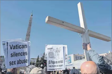  ??  ?? None so blind: Members of Ending Clergy Abuse, a global organisati­on of survivors and others, protest in Rome during the February 2019 papal summit on the sex abuse crisis in the Catholic Church. Deaf-mute Italian children are alleged to be among those abused by priests. Photo: Vincenzo Pinto/afp