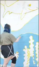  ?? (NWA Democrat-Gazette/Annette Beard) ?? Senior art student Reese Abbott said she enjoyed working on the mural at Pea Ridge City Park.