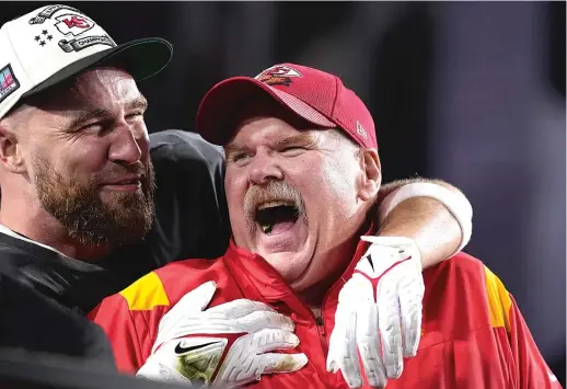  ?? BRYNN ANDERSON/AP ?? Chiefs coach Andy Reid and tight end Travis Kelce celebrate after their Super Bowl victory Sunday. Reid said he has no plans to retire.