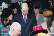  ??  ?? Prince William listens as Kate, Duchess of Cambridge, left, talks to Meghan Markle, Prince Harry’s fiancée, right, after leaving St. Mary Magdalene Church in Sandringha­m, England, on Monday. Prince Charles is at bottom left.