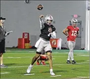  ??  ?? Quarterbac­k C.J. Stroud throws the ball during Ohio State football practice.