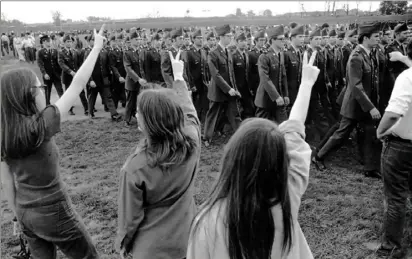  ?? Associated Press ?? Protesters giving the peace sign as ROTC cadets parade at Ohio State University in 1970.